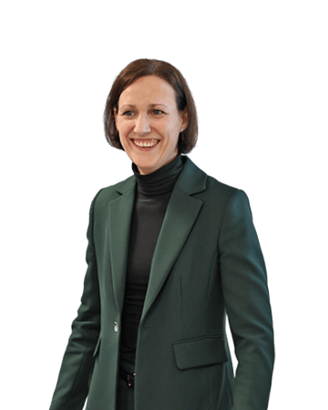 Lächelnde weibliche Vertrieblerin im grünen Blazer 